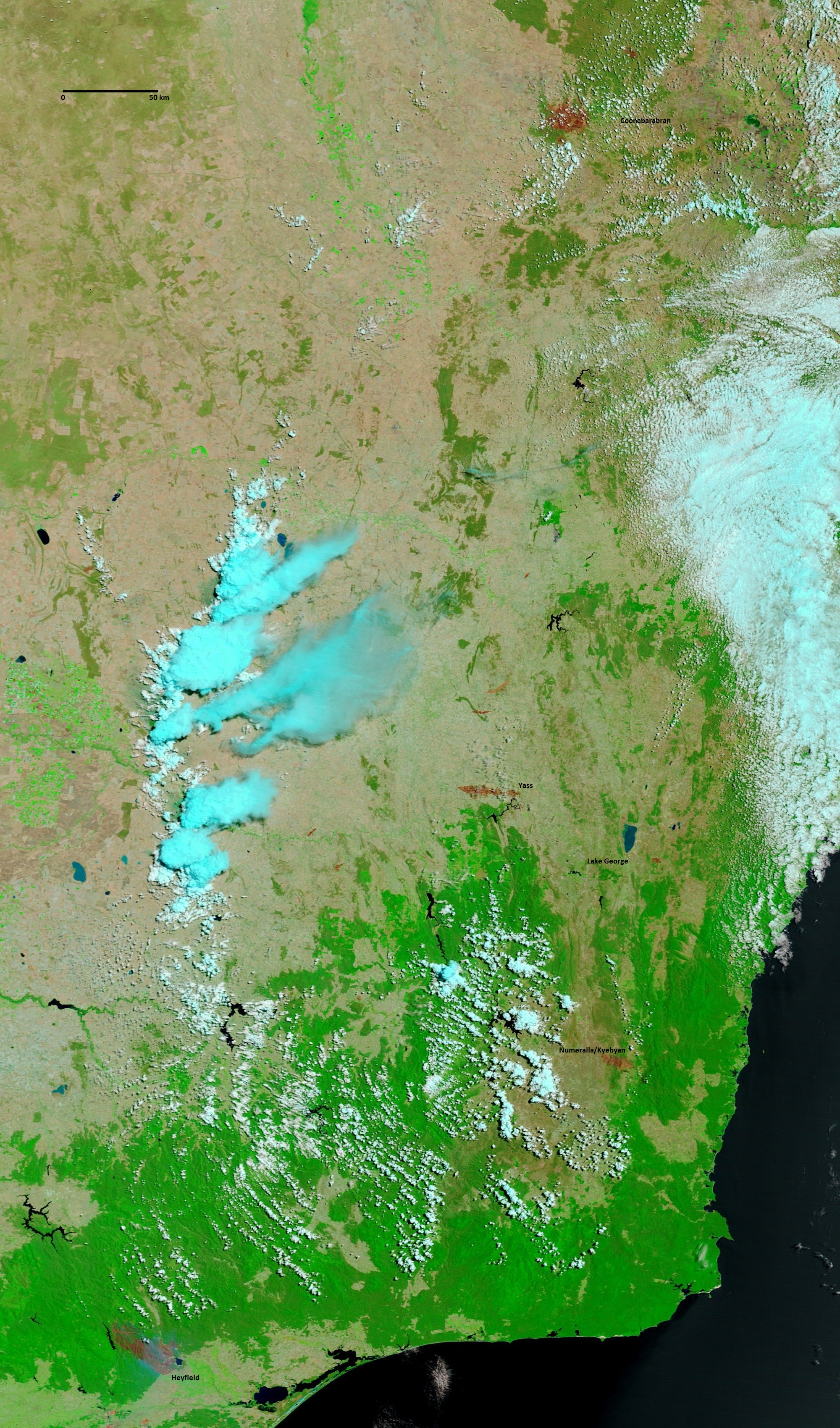 Satellite image looking down over parts of NSW and Victoria showing smoke plumes