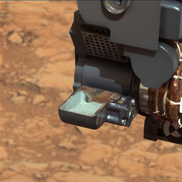 This image from NASA's Curiosity rover shows the first sample of powdered rock extracted by the rover's drill. Image credit: NASA/JPL-Caltech/MSSS