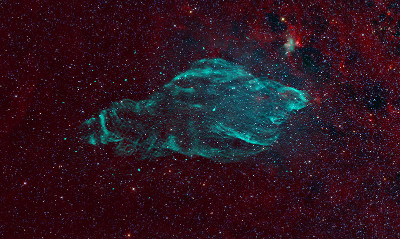 The W50 supernova remnant in radio (green) against the infrared background of stars and dust (red).CREDIT: NRAO/AUI/NSF, K. Golap, M. Goss; NASA’s Wide Field Survey Explorer (WISE).