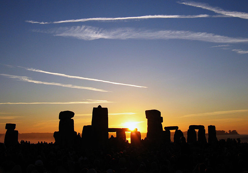 The sun rising over Stonehenge in Britain.
