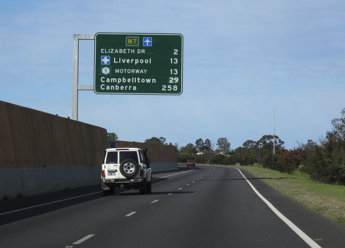 road sign showing distance to Canberra