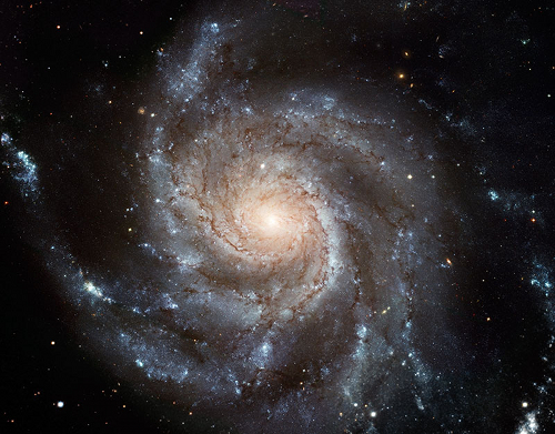 A galaxy with starry arms sweeping out from its centre.