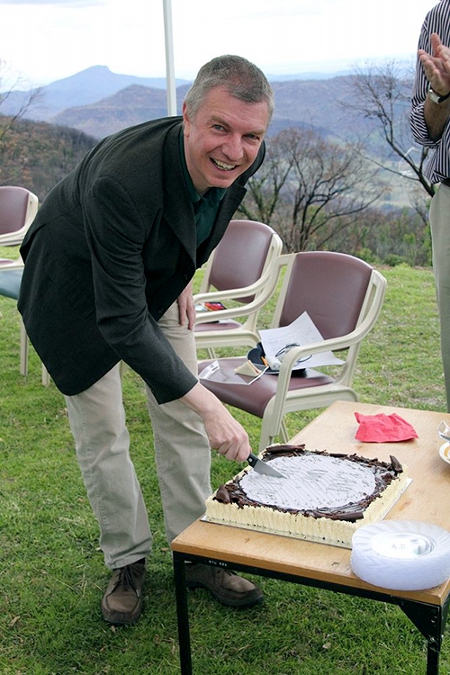 Professor Matthias Steinmetz cuts the cake at the post-RAVE party. Photo: David Malin