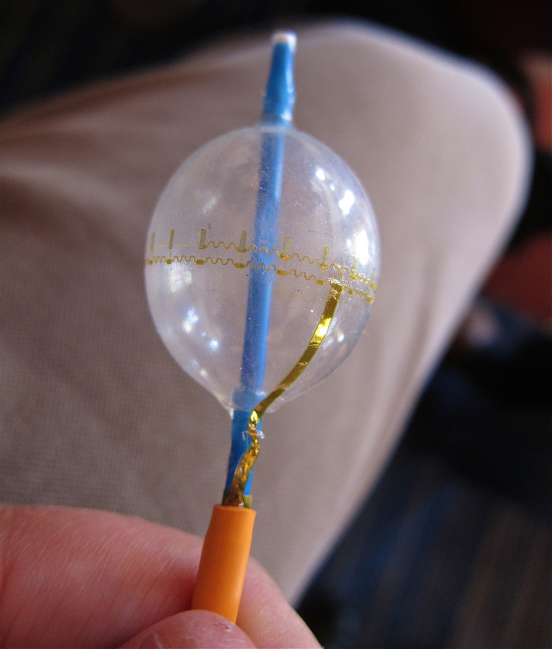 Temperature and EKG sensors and LEDs wrapped around a cardiac balloon catheter. The wires are stretchable coils. Image: jurvetson