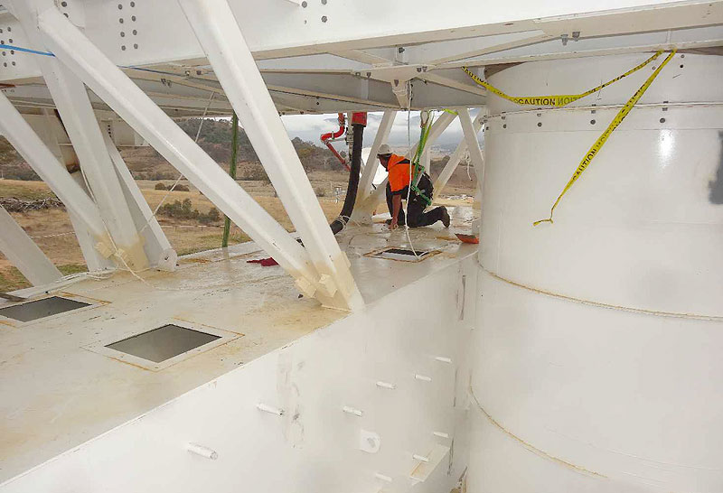 The concrete-metal mix is poured into compartments inside the antenna counterweight.