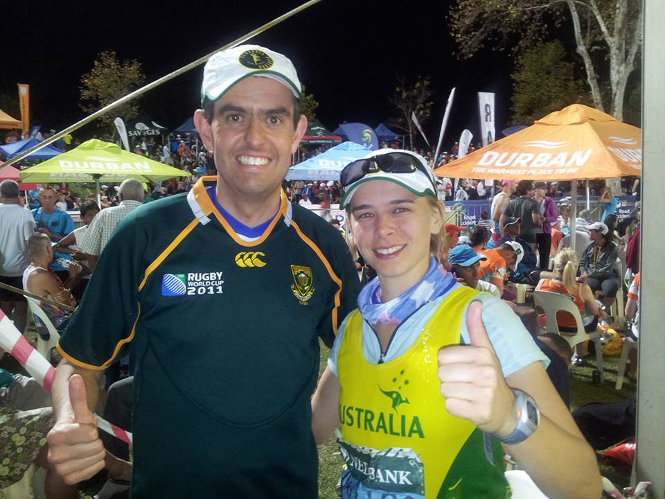 A male (Daan De Toit) and female (Lisa Harvey-Smith) smile at the camera following the Comrades race in 2013.