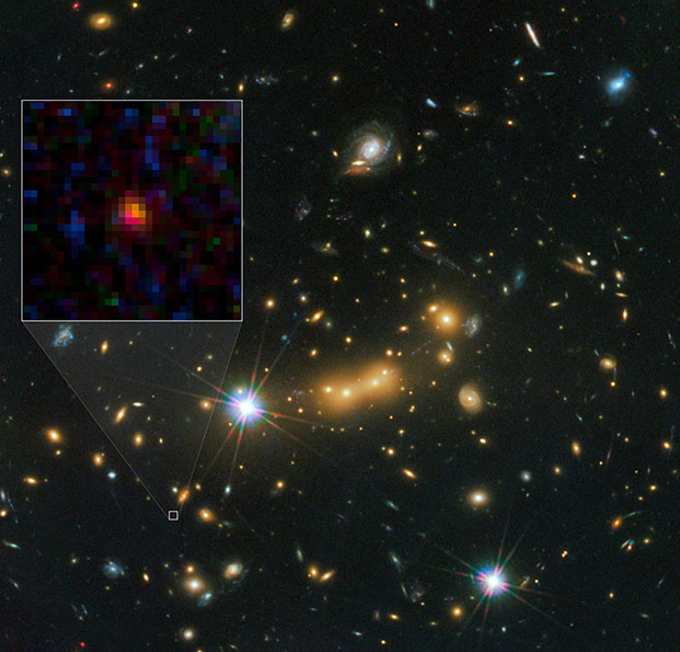 The current contender for the most distant galaxy known: a tiny red blob called MACS0647-JD. Credit: Credit: NASA, ESA, and M. Postman and D. Coe (STScI) and CLASH Team.