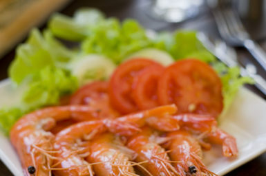 A plate of prawns and salad