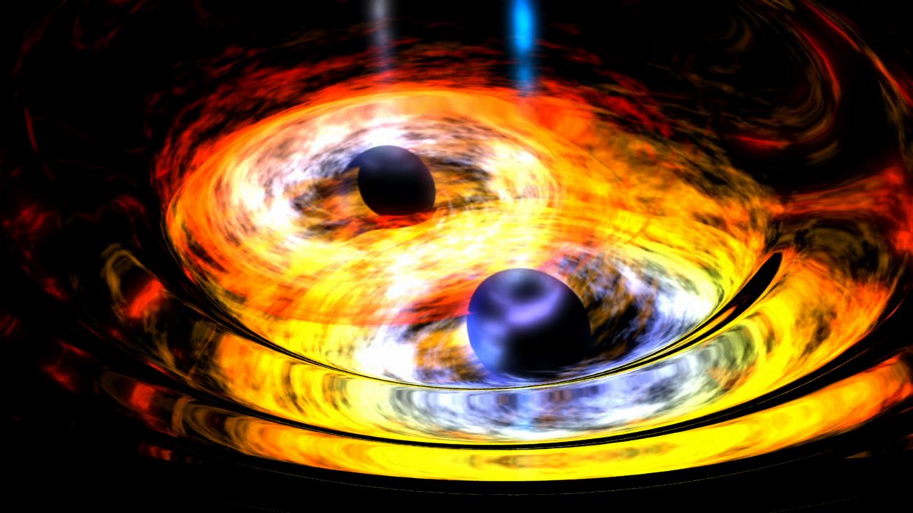 Two black holes are entwined in a gravitational tango in this artist's conception. Supermassive black holes at the hearts of galaxies are thought to form through the merging of smaller, yet still massive black holes, such as the ones depicted here.  Image Credit: NASA