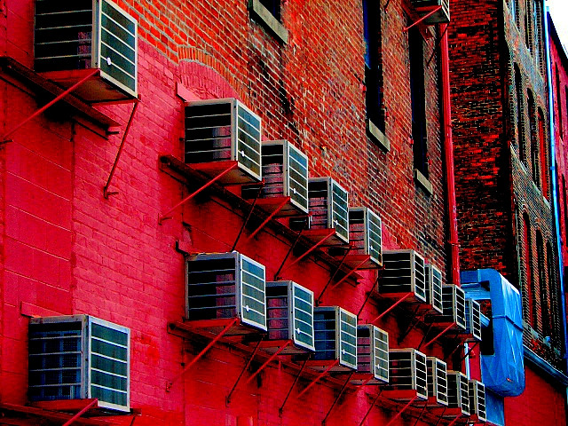 Air conditioners along the side of a building