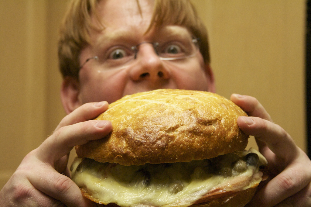 Man eating a large burger