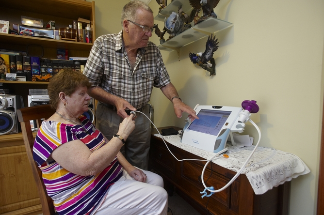 Janice from Bacchus Marsh, Victoria, measures her blood oxygen with the help of her husband and carer Bill. Her health stats are sent via a telehealth device to a local diabetes nurse who checks on her daily.