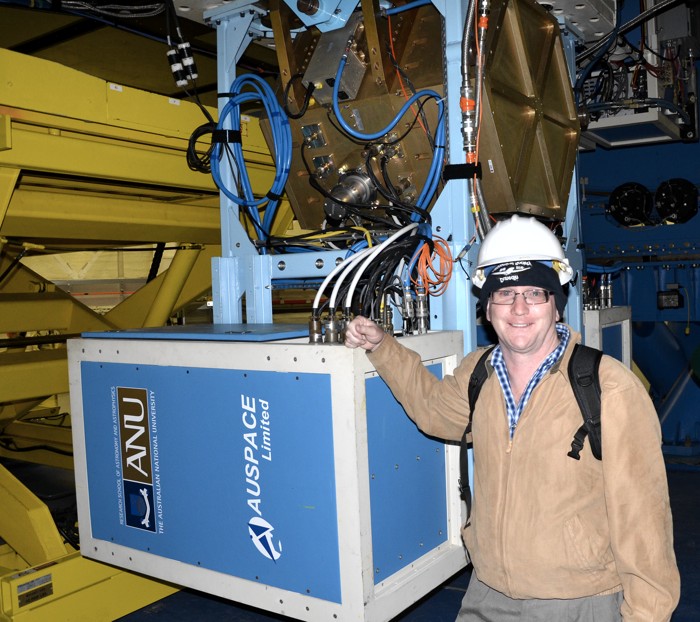 Australian Gemini Office astronomer Dr Stuart Ryder in front of the Near-Infrared Integral Field Spectrometer (NIFS) built by the Australian National University's Research School of Astronomy and Astrophysics.