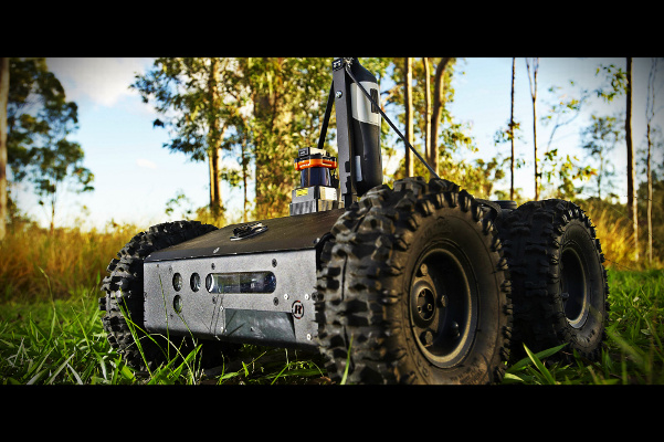 A small rugged four wheeled robot vehicle.