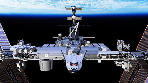 Artist's concept of the Dream Chaser spacecraft docked to the International Space Station. Image: SNC
