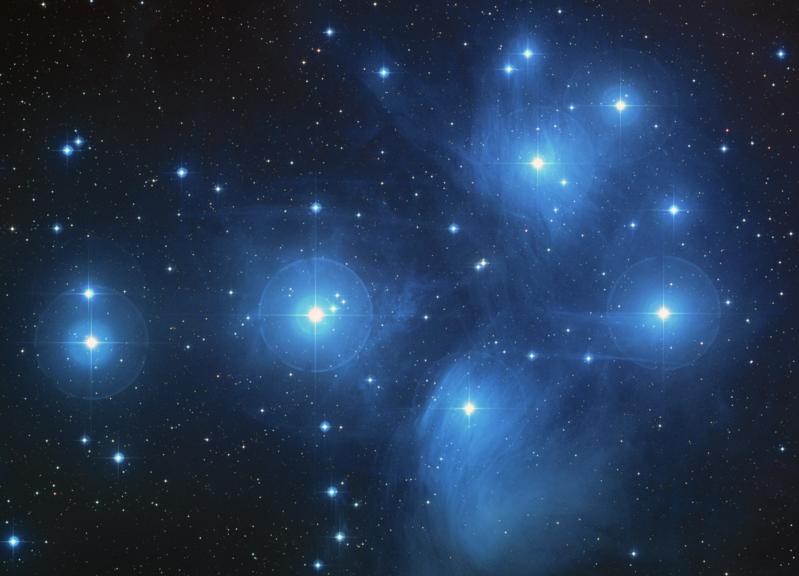 Black background with numerous bright blue-white stars.
