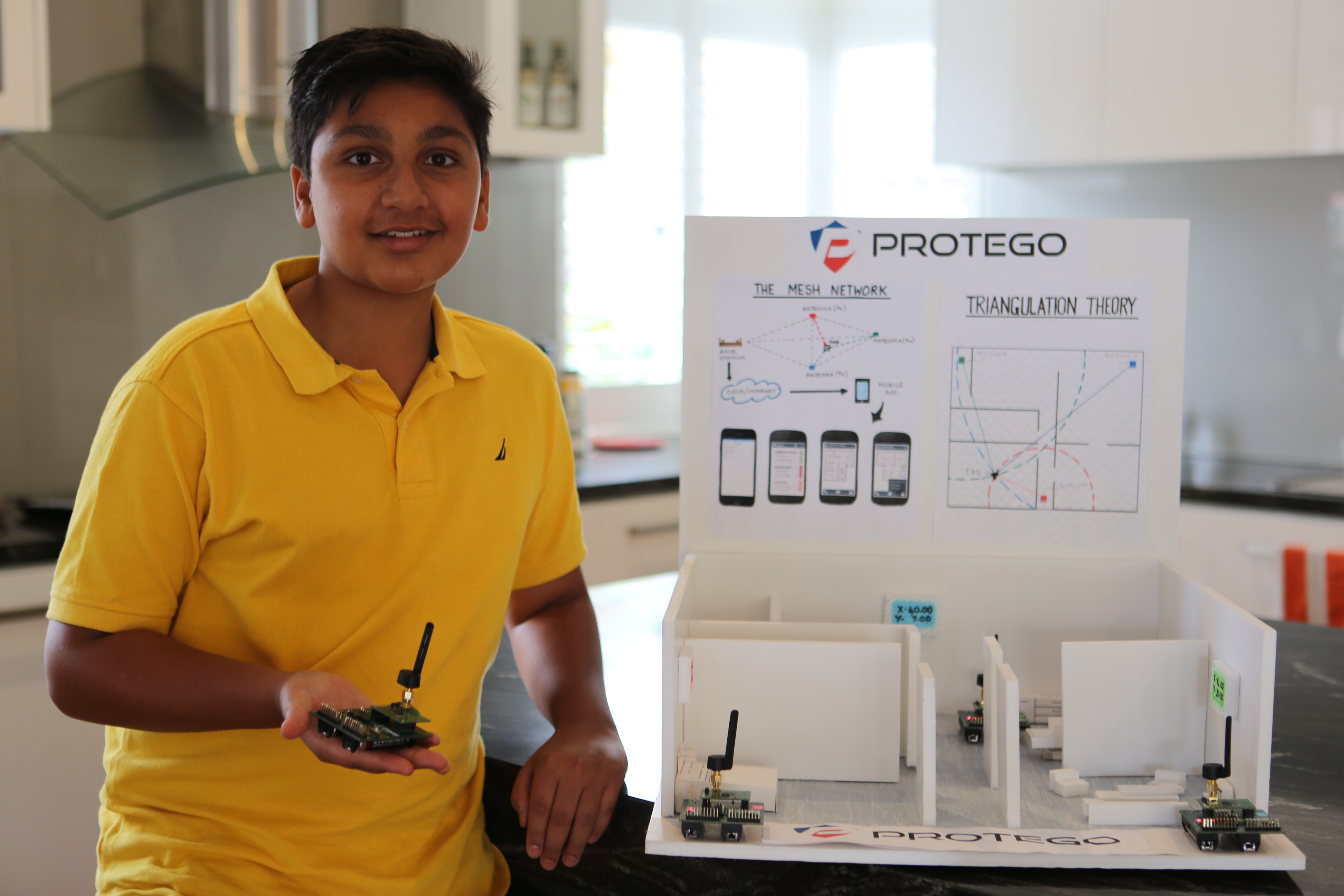 The youngest finalist Dhruv, shows off his in-home sensors, PROTEGO