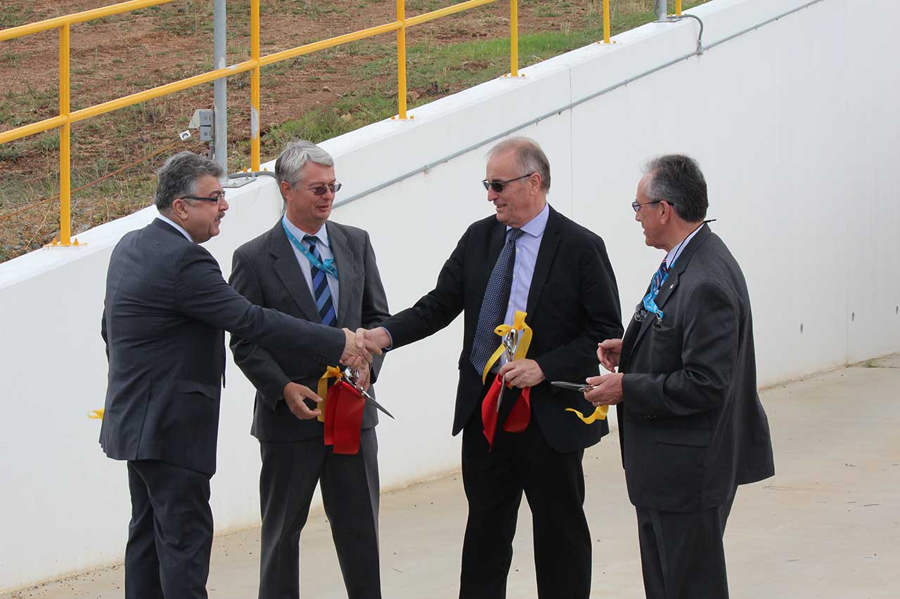 CONGRATULATIONS: NASA's Mr Badri Younes (left) shakes hands with CSIRO's Dr Dave Williams following the ribbon cutting with CDSCC Director, Dr Ed Kruzins (2nd left) and NASA's Mr Pete Vrotsos (right) at the commissioning of Deep Space Station 35.
