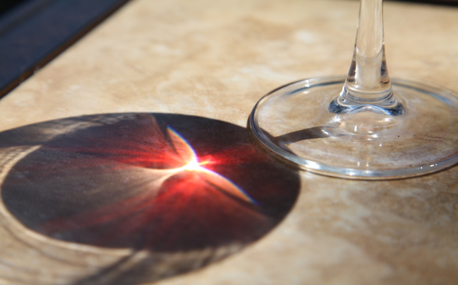 Note the differing colours from the light through the wineglass. Image credit - Anataman, Flickr.