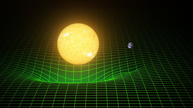 Space time (represented here with a greeen grid) is warped by massive bodies, such as the Sun and Earth. Einstein's theory predicted existence of gravitational waves, which are ripples in space and time. These waves, which move at the speed of light, are created when massive bodies accelerate through space and time. Image credit - LIGO 