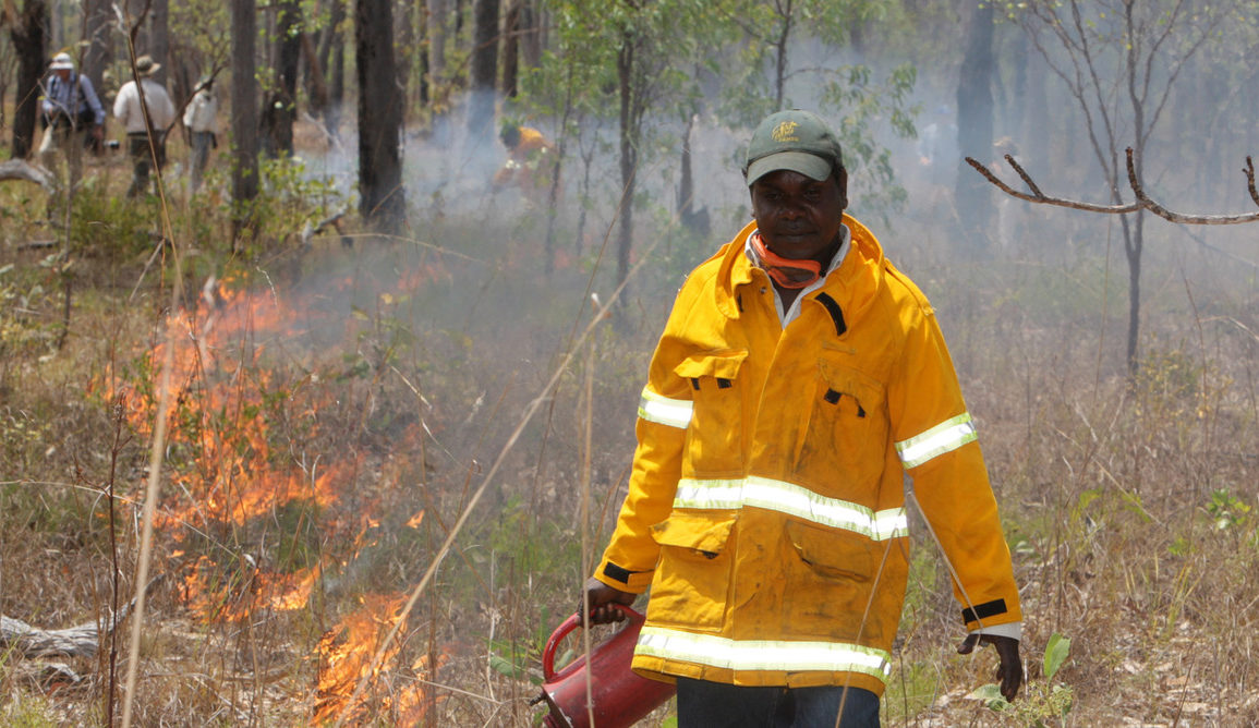Marcus Cameron of Manwurrk Rangers laying a fire break for traditional management of country in the Djelk and Warddeken Indigenous Protected Areas.