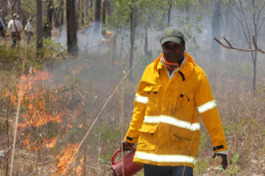 Marcus Cameron of Manwurrk Rangers laying a fire break for traditional management of country in the Djelk and Warddeken Indigenous Protected Areas.