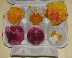 Image of eggs after experiment where coloured crystals have formed