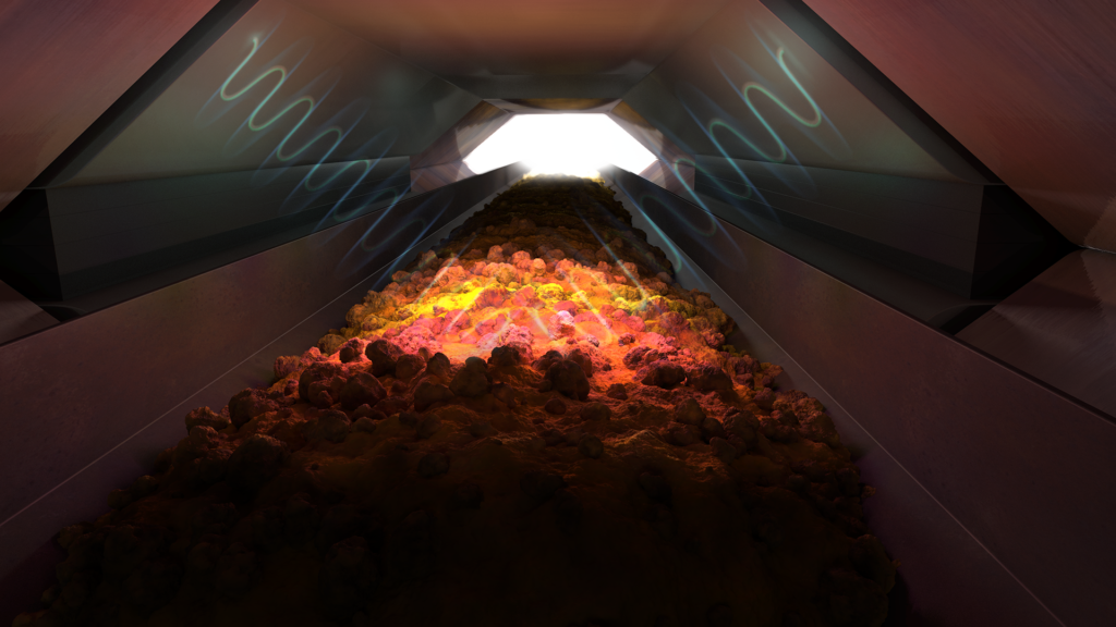 Rock illuminated by radio waves on a conveyor inside the analyser 