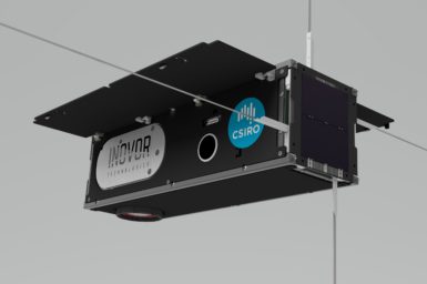 Long black box with silver antennas emerging from 4 sides of the box, and solar panels extended on the top. Has the names of Inovor Technologies and CSIRO on the side of the box.