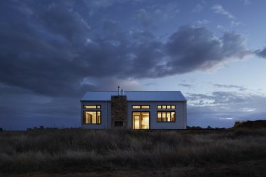 A remote house with lights on