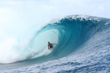 Surfer inside barrel of a wave