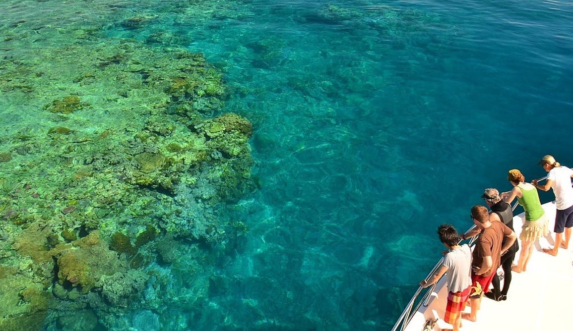 Tourists viewing the Great Barrier Reef from a boat