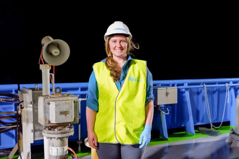 CSIRO researcher Karlie McDonald onboard RV Investigator at night wearing PPE gear.