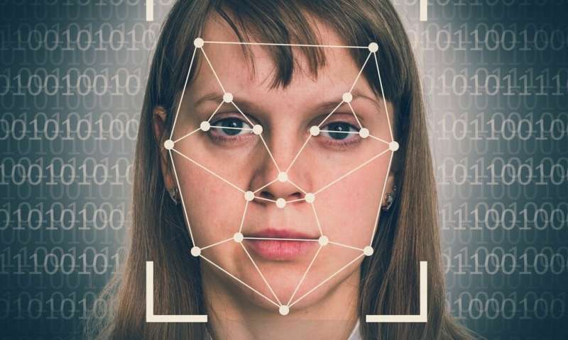 Woman with facial mapping technology edited over face.