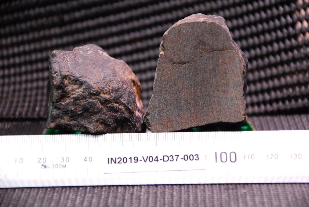 Basalt measured against a ruler
