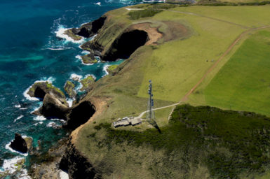 aerial view of the cape grim station on a cliff on the coast