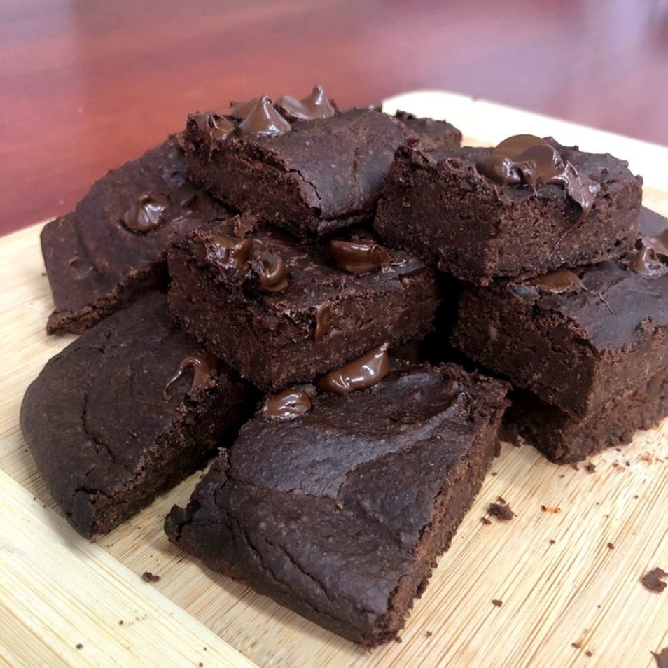 chocolate brownies on a wooden bread board