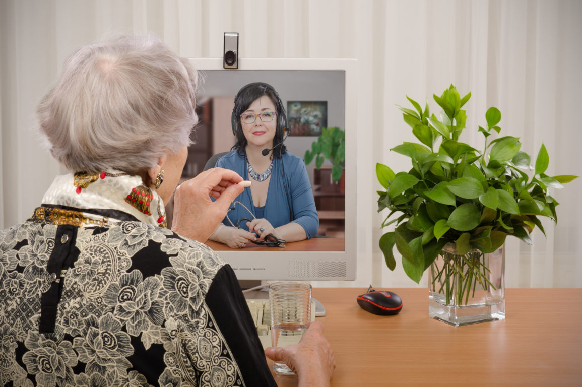 An older Australian talking to their doctor through video call.