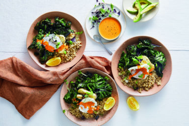 three bowls of vegetarian low-carb meals with another bowl with orange liquid on top.