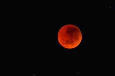 Total lunar eclipse (red moon) in black sky