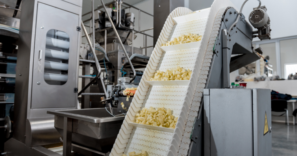 Chips going up a conveyor belt system in production line
