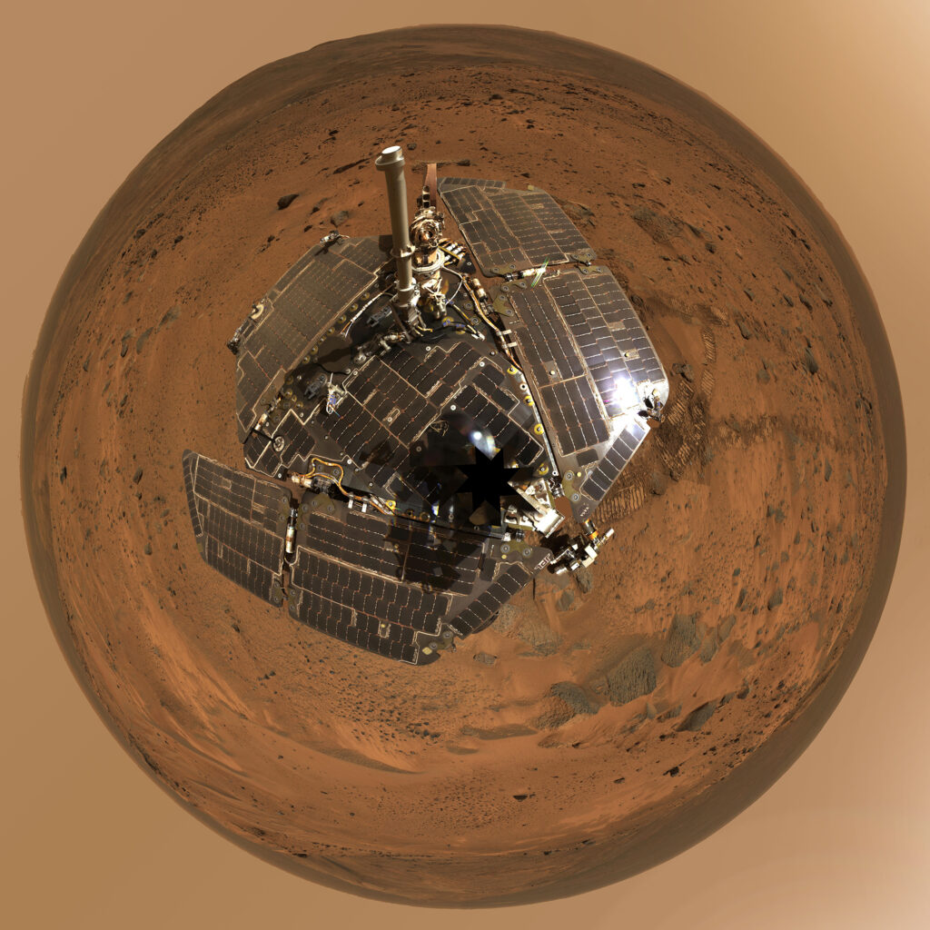 Fish eye lens image of space rover on red planet. 